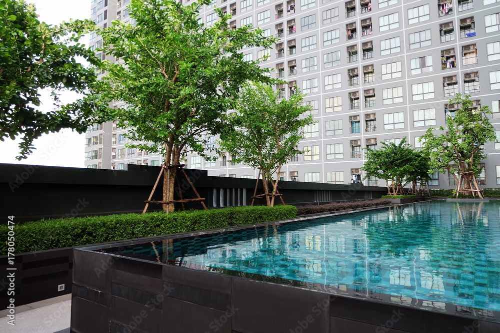 Swimming Pool with Modern Condominium Background Great for Any Use.
