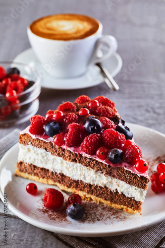 Piece of fruit cake with cup of coffee