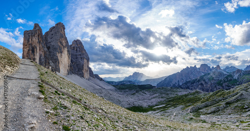 Tre Cime di Lavaredo rocks big panorama at sunset with track photo