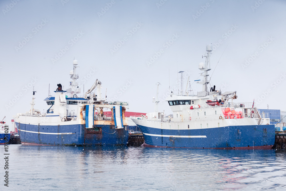 Industrial fishing ships. Blue white trawlers