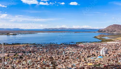 Peruvian city Puno and lake Titicaca panorama, Peru photo