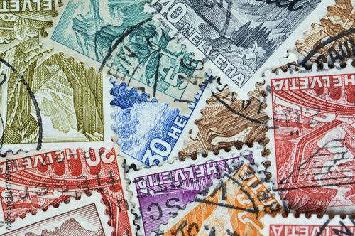 Collection of old Swiss postal stamps from the early 1900s. Helvetia