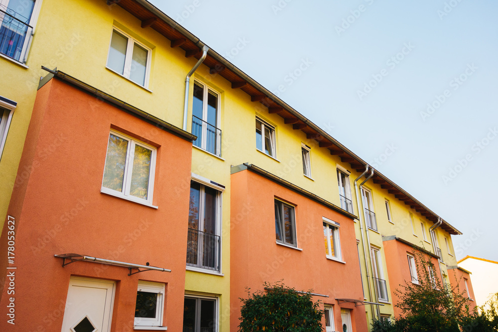 orange and yellow facaded row houses at berlin