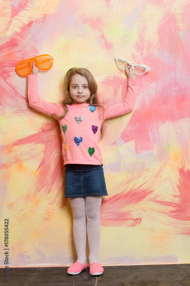 Child girl on colorful background.