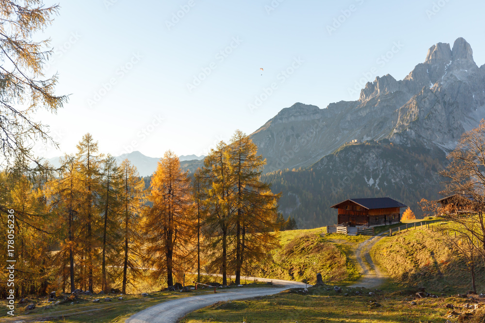 Alpine landscape with old mountain hut in autumn. Austria, Alps