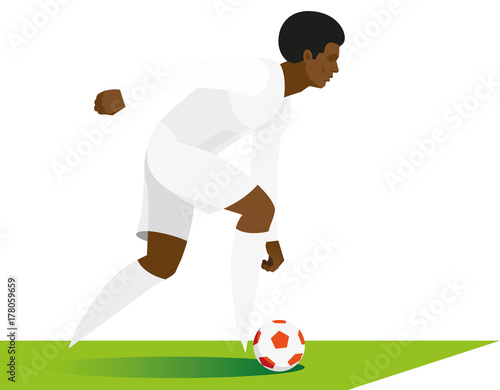 african-american football forward demonstrates his dribbling