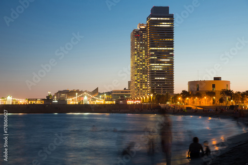 Barceloneta beach with skyscrapers in sunset