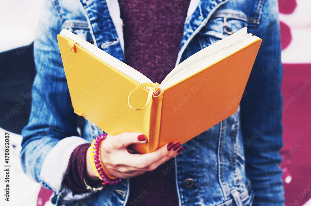 Fototapeta premium Student reading open copybook