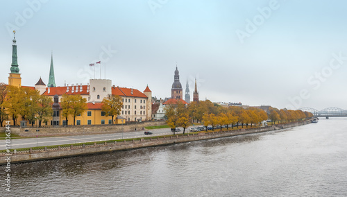 Waterfront of Daugava river and medieval part of old Riga at misty morning. Riga is the capital of Latvia and famous tourist site in Baltic region of Europe
