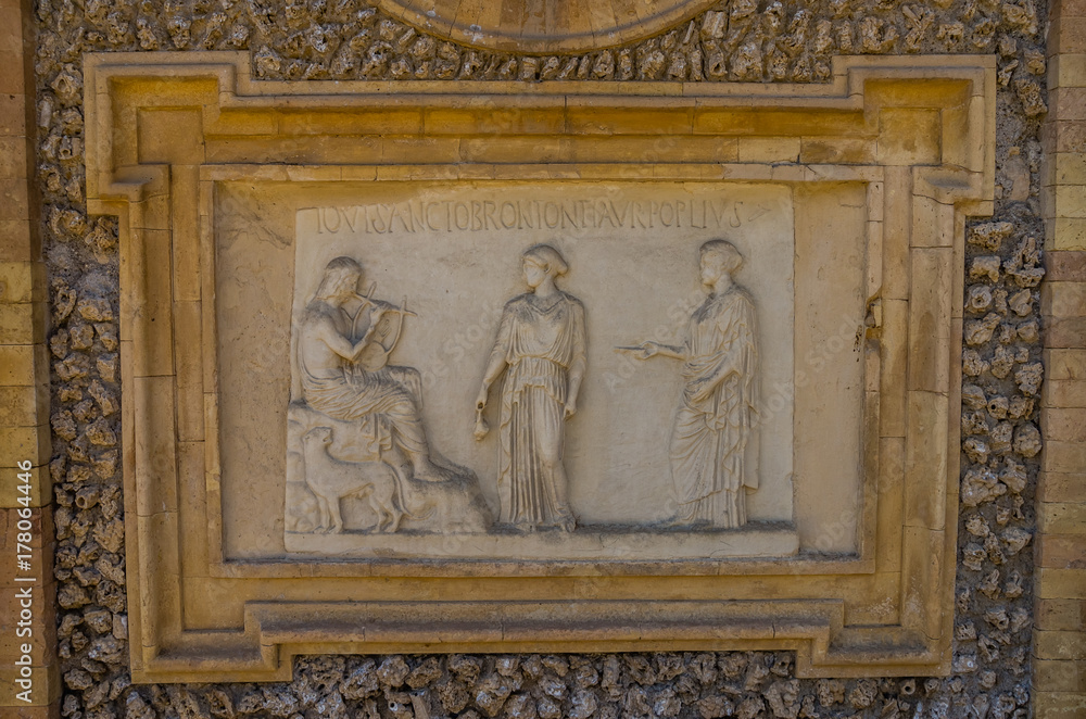 Ancient sculpture paintings on a fragment of the wall in the Villa Doria-Pamphili in Rome, Italy
