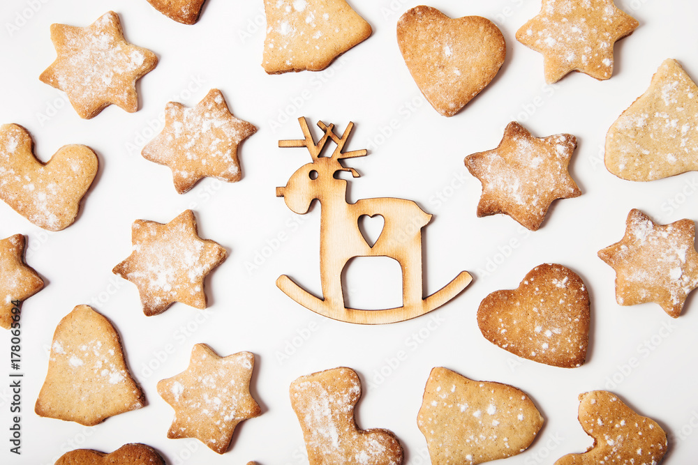 Christmas background with gingerbread and Christmas deer.Holiday,new year concept.Flat lay. Christmas background with gingerbread and Christmas deer.Holiday,new year concept.Flat lay.