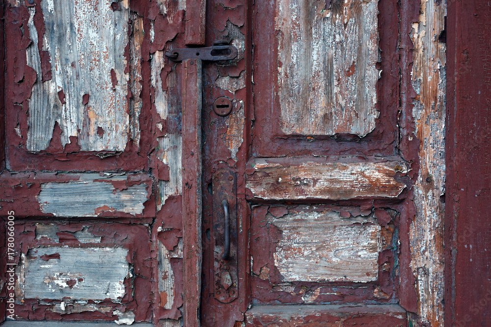 Old red painted textured grungy wooden door Old red painted textured grungy wooden door