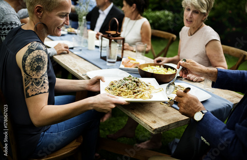 Group of diverse friends are having a dinner together