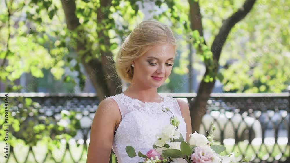 portrait of a bride close-up on wedding day. walk in the park portrait of a bride close-up on wedding day. walk in the park