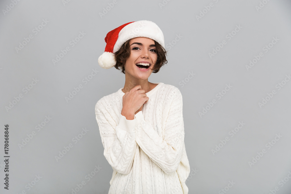 Portrait of a young laughing girl in christmas hat posing Portrait of a young laughing girl in christmas hat posing