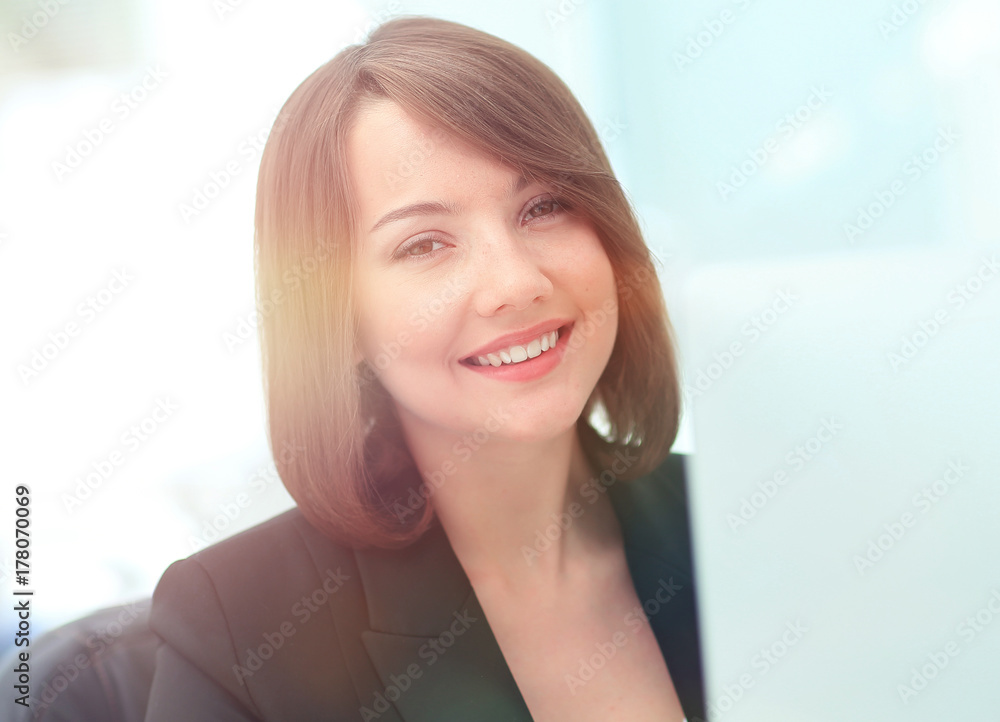 Beautiful business woman dreaming while working on computer at h Beautiful business woman dreaming while working on computer at h