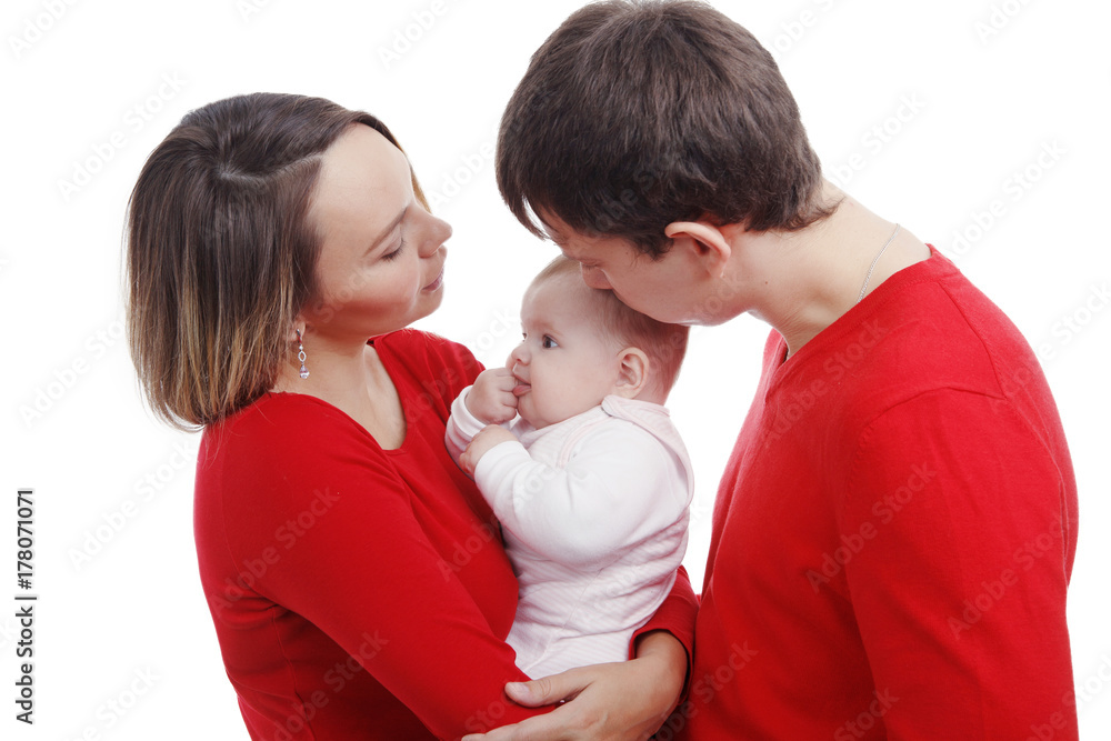 Close up of parents cuddling adorable baby. Image isolated against white background Close up of parents cuddling adorable baby. Image isolated against white background