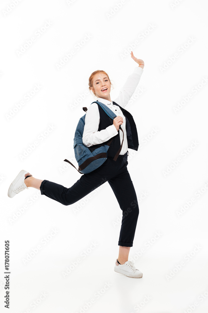 Full length image of happy gigner student woman with backpack Full length image of happy gigner student woman with backpack