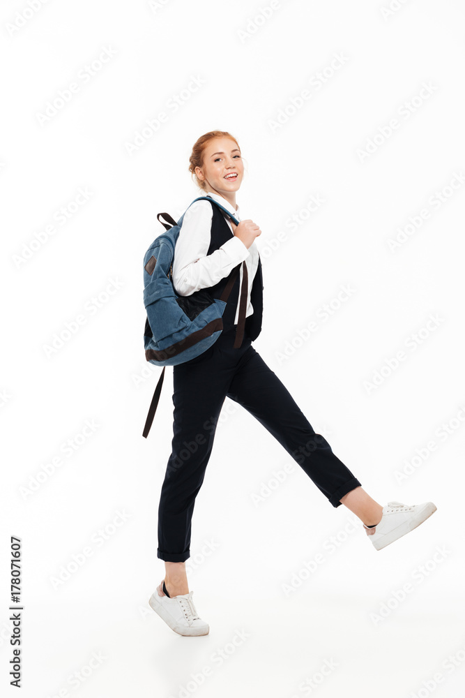 Full length image of pleased gigner student woman with backpack Full length image of pleased gigner student woman with backpack