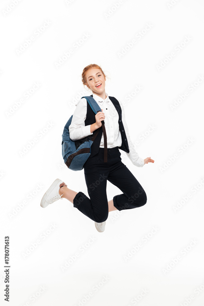 Full length image of carefree gigner student woman with backpack Full length image of carefree gigner student woman with backpack