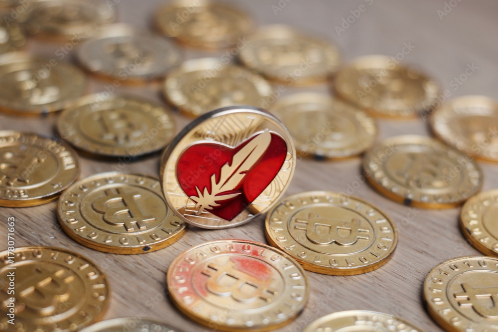 Feather heart gold coin