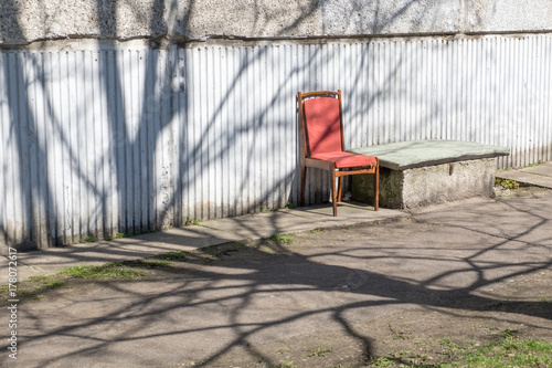 Senior's chair near a block of flats