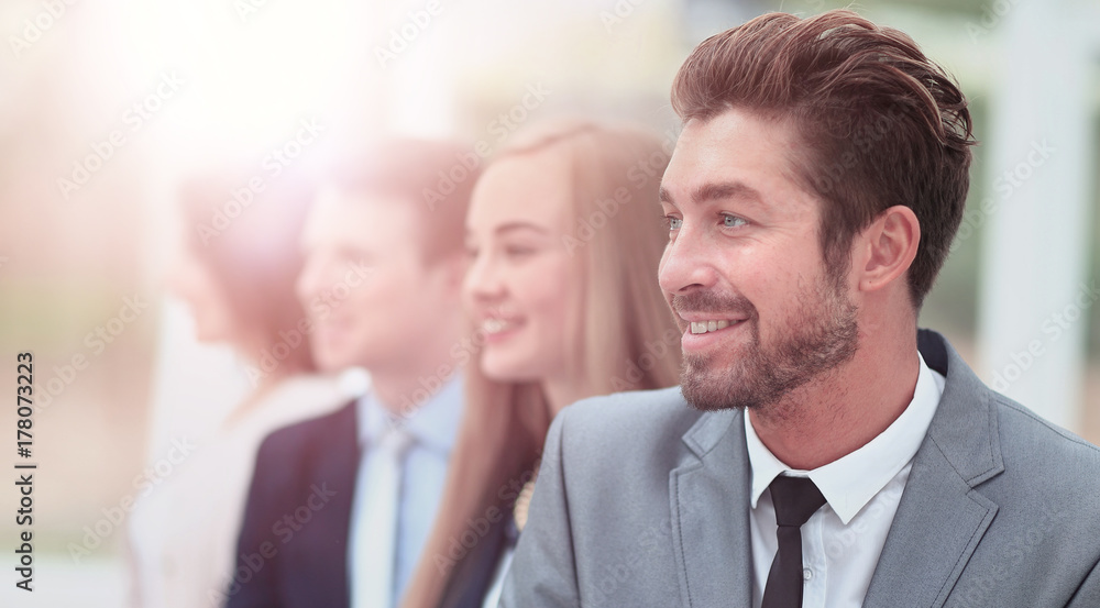 group of business people smiling in an office group of business people smiling in an office