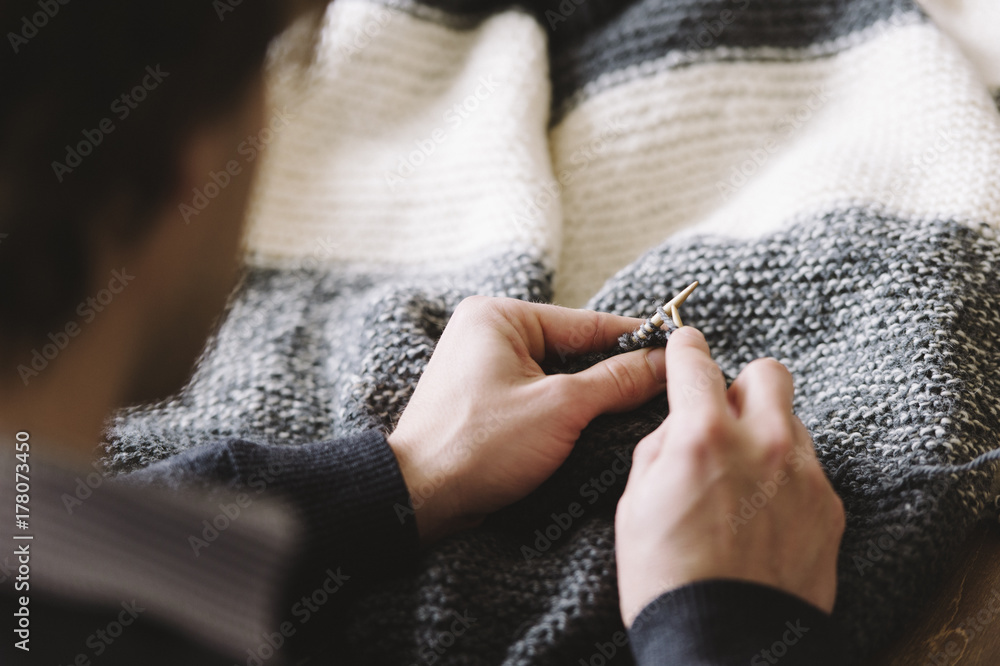 Man knitting a blanket Man knitting a blanket