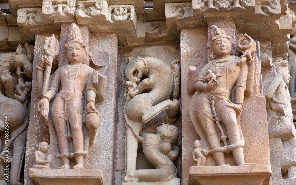 Ancient bas-relief at famous erotic temple in Khajuraho, India