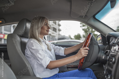 Confident businesswoman driving car photo