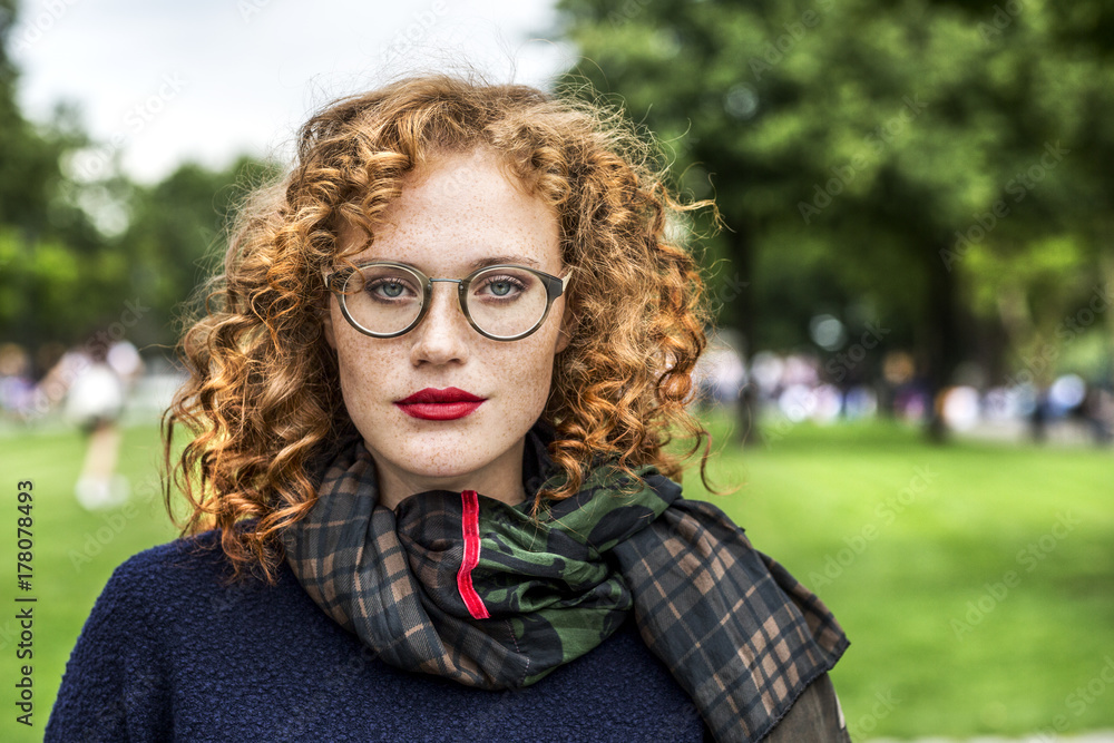 Portrait of redheaded young woman wearing glasses Portrait of redheaded young woman wearing glasses