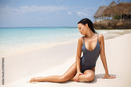 Beautiful girl in a sexy bikini on the beach