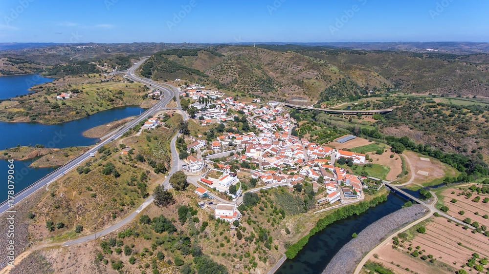 Aerial. Odeleyte village on a dam reservoir. Portugal