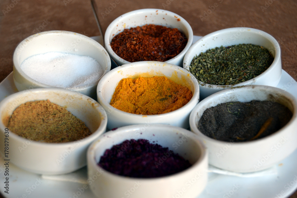 Different spices on kitchen table Different spices on kitchen table