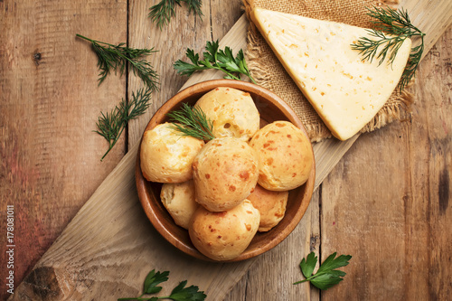 Homemade cheese buns, rustic style, vintage wooden background, top view photo