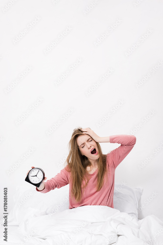 sleepy woman with alarm clock sleepy woman with alarm clock