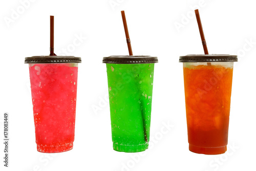 iced red soda, green soda and lemon tea in transparent plastic glass with brown lid and straw. isolated on white background with clipping path.