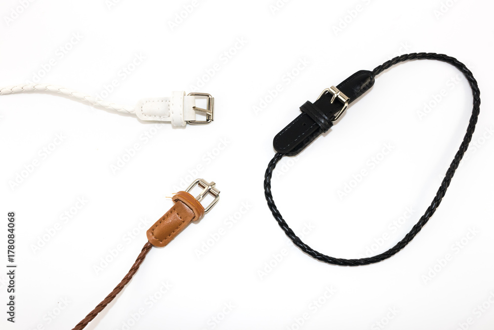 Small variety color fashion belt on white backdrop Small variety color fashion belt on white backdrop