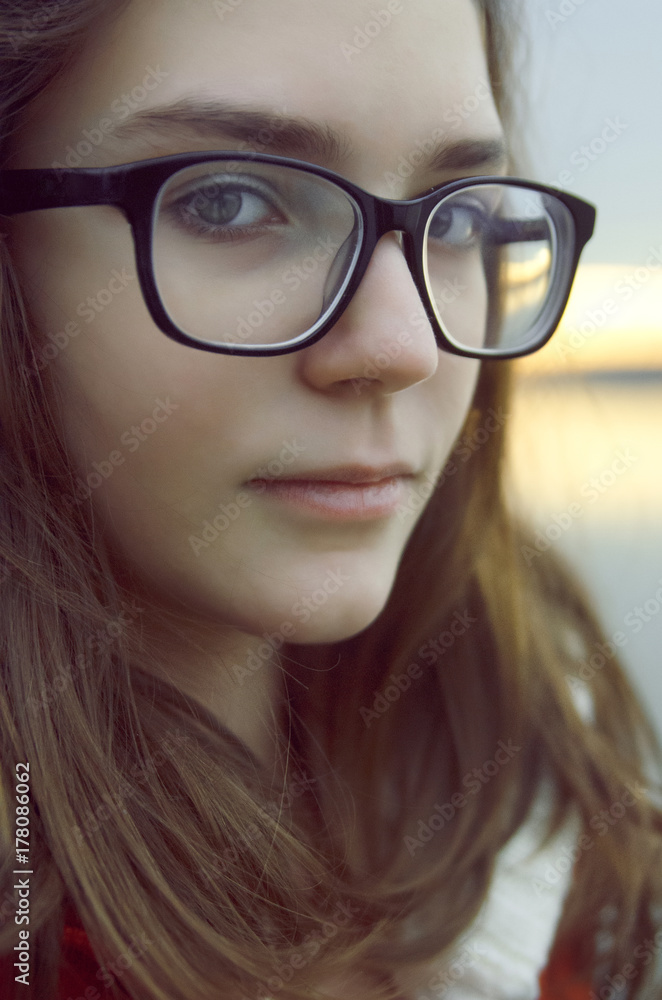 Portrait of young girl with glasses,close up Portrait of young girl with glasses,close up