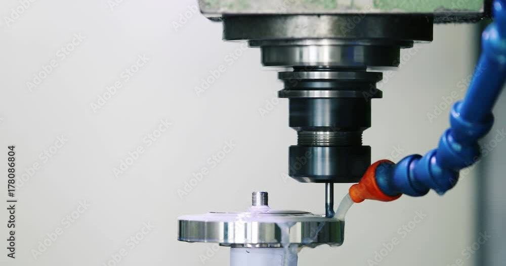 industrial worker working with cnc milling machine industrial worker working with cnc milling machine