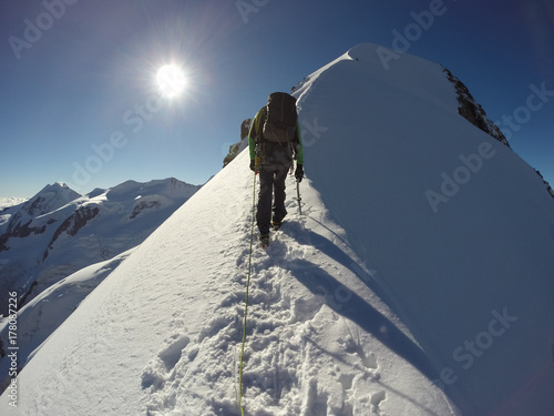 Wallpaper Mural Man climbing at Piz Bernina peak Torontodigital.ca