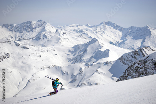 Man walking with skis in snow