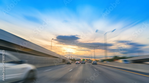 Photography on the road in highway light traffic with sunset at motorway