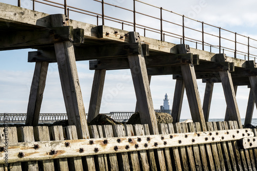 Lighthouse and pier photo