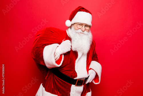 Holly jolly x mas festive noel miracles and magic time! Funny santa in headwear, costume, black belt, white gloves brings a lot of gifts for kids, ready, prepared, sale promotion concept