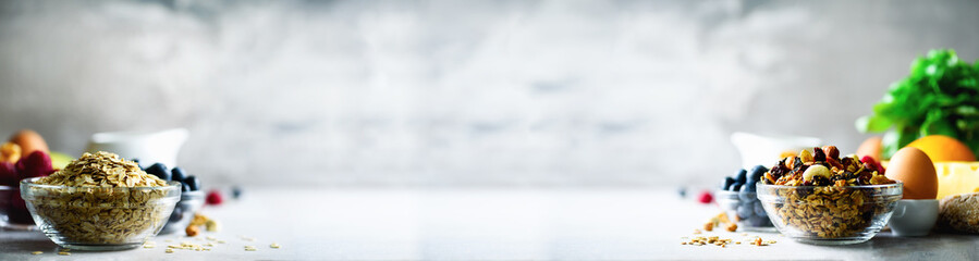 Homemade granola with milk, fresh berries, milk for breakfast. Copy space. Healthy breakfast concept. Banner