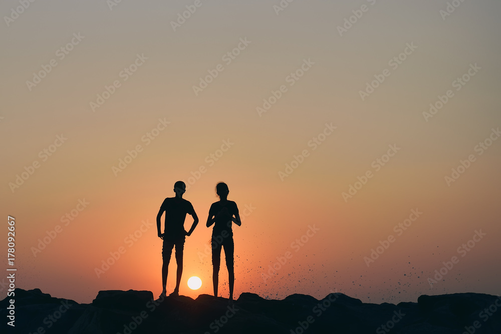 silhouette of couple on the background of a beautiful sunset