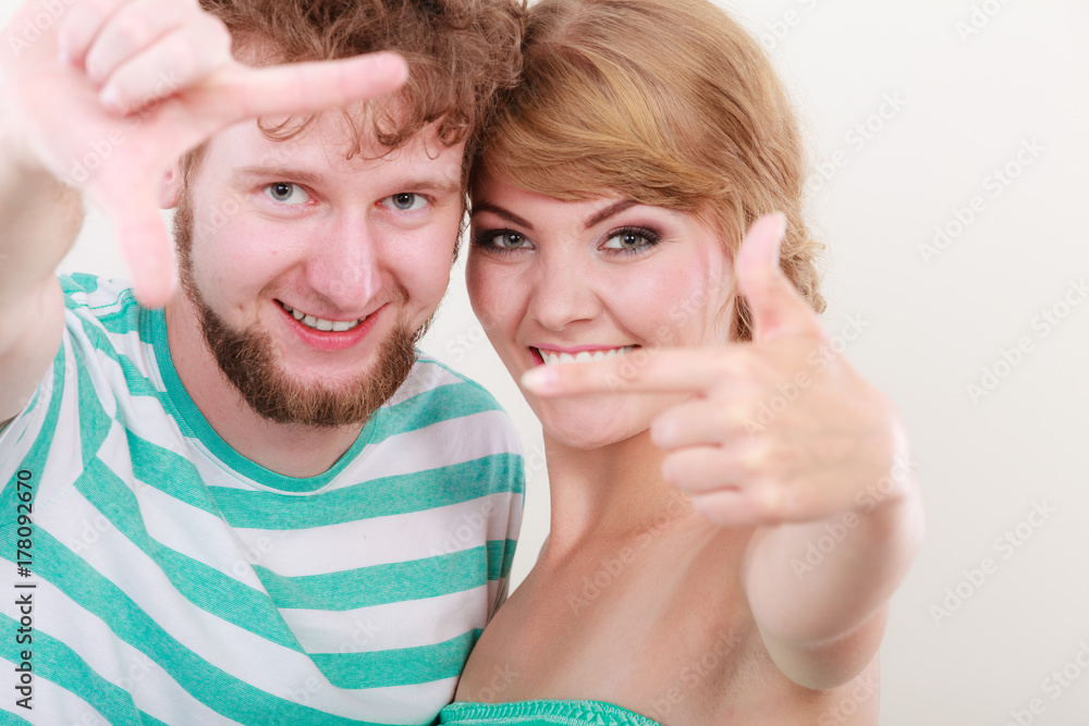 happy couple making frame with hands happy couple making frame with hands