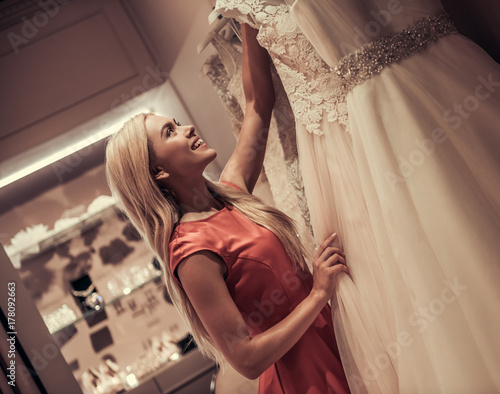 Attractive bride in wedding salon