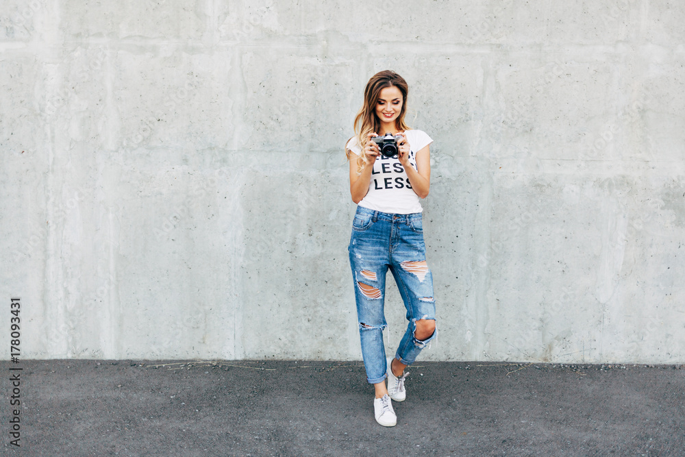 Stylish woman photographer in white T-shirt with word Stylish woman photographer in white T-shirt with word